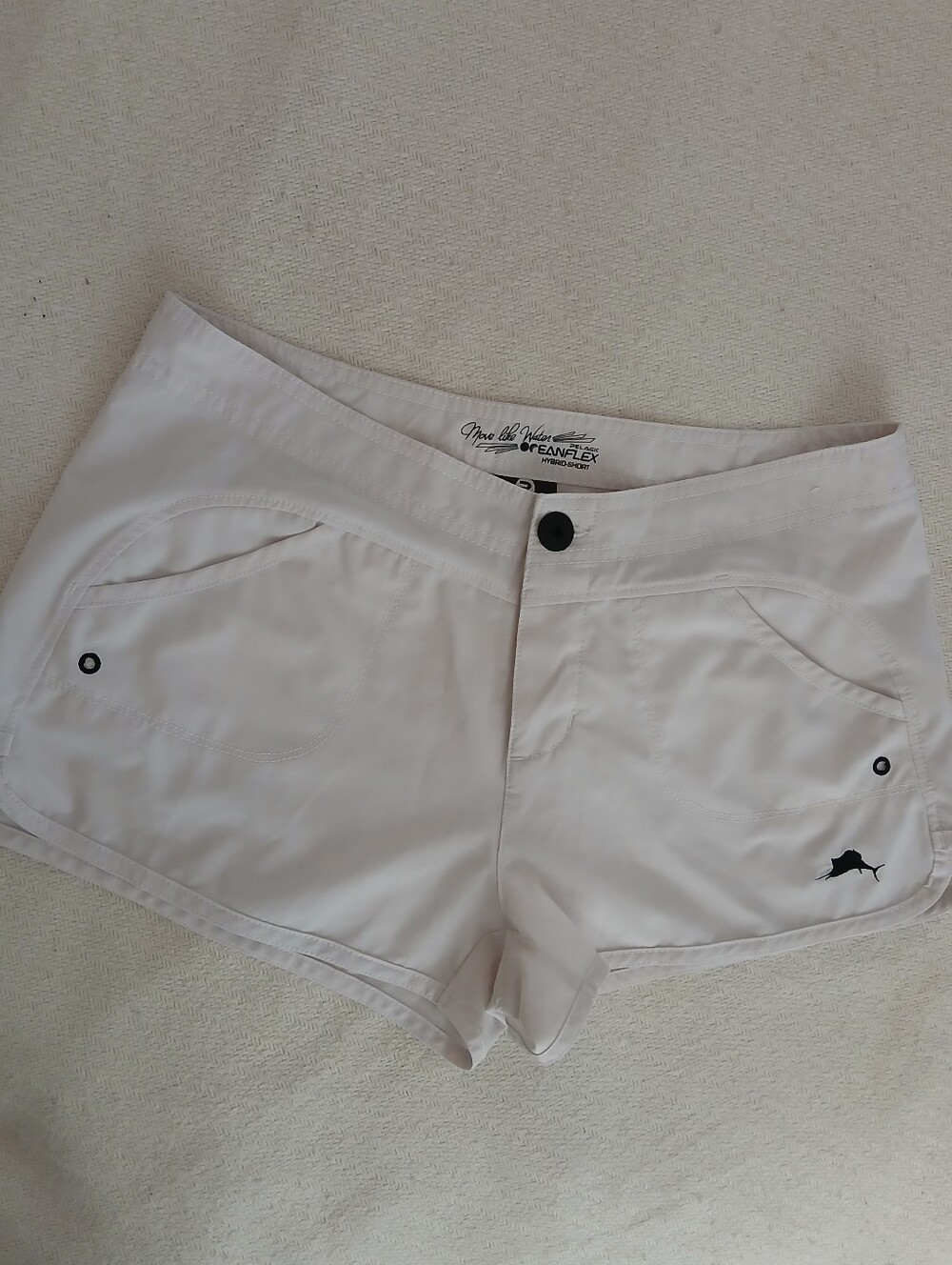 Pelagic White Women's Athletic Shorts with Black Fish Logo